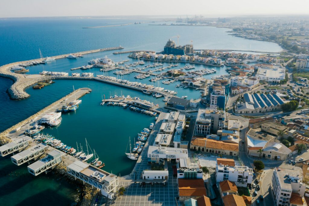 Home Stunning aerial view of Limassol Marina, Cyprus featuring yachts and urban landscape.